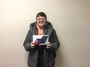 Daphné Giguere-Bosse holding the tablet that she won.